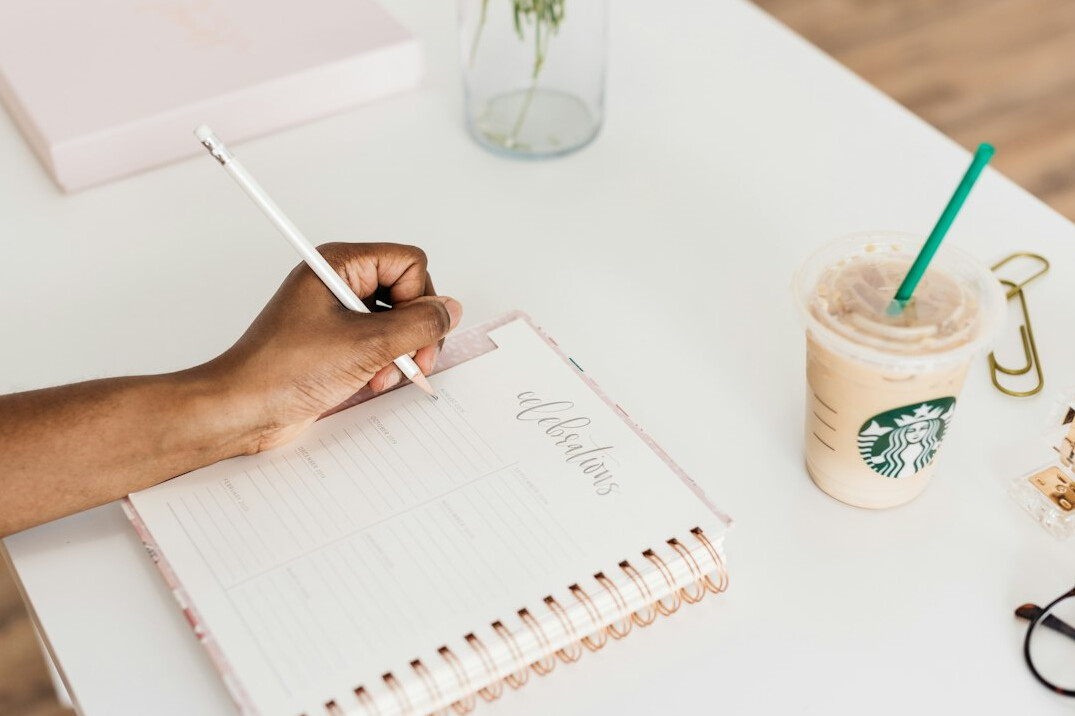 journal writing at desk