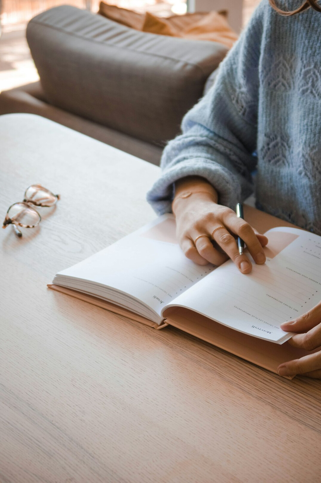 person journaling at desk